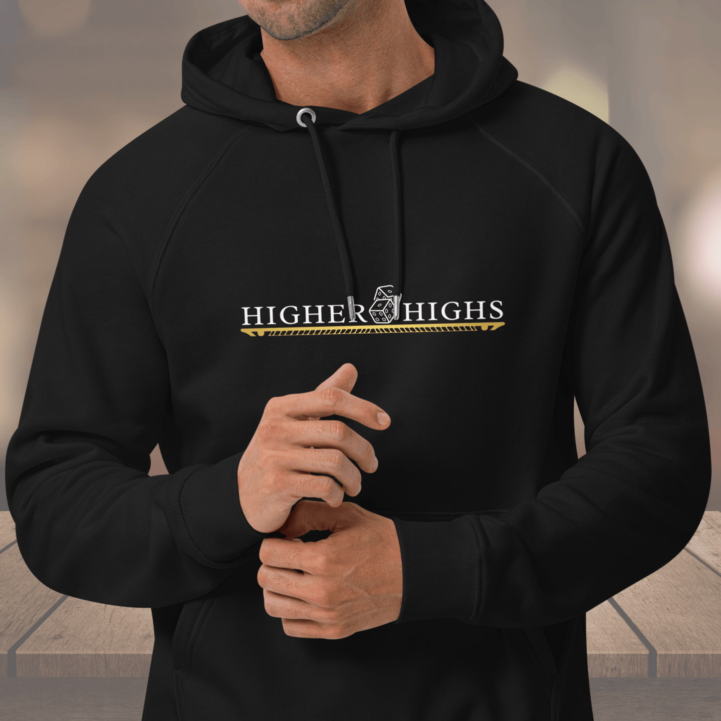 black hoodie. The front of the hoodie has the phrase Higher Highs printed in bold letters, while the back features the message Never Give Up. This trendy hoodie is perfect for those seeking comfort and inspiration in their wardrobe. Get yours today and make a fashion statement with this motivational cotton hoodie pullover. Ideal for workouts or casual wear, this hoodie is a must-have for anyone looking for a high-quality, stylish garment with a positive message. Shop now.